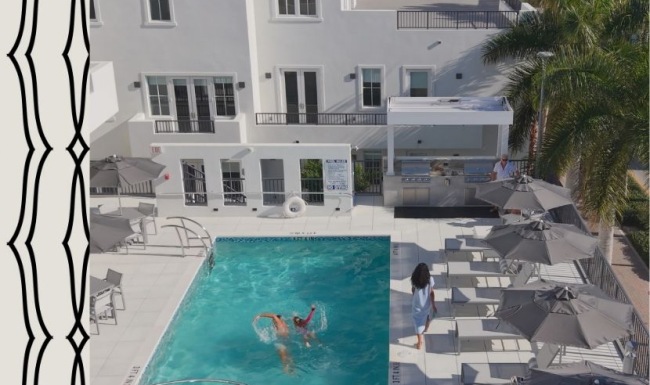 Resort-style swimming pool with lounge seating