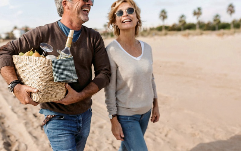 a couple walking along a beach